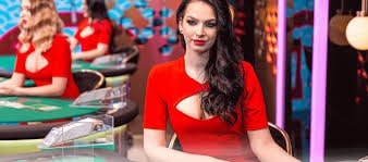 Filipino player watching live dealer baccarat stream on mobile phone